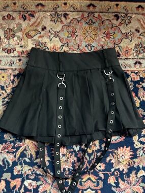 Social Collision Black Pleated Mini Skirt with Grommet Strap Detail